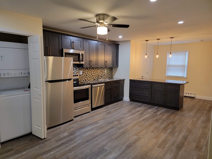Newly installed, stylish vinyl planks offer a modern look while providing waterproof and scratch-resistant durability. Attract quality tenants with upgraded flooring. Rental kitchen flooring, LVP installation, tenant-proof flooring, investment property renovations, modern vinyl planks.